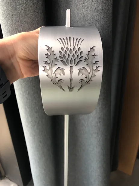 A sword hilt with a thistle