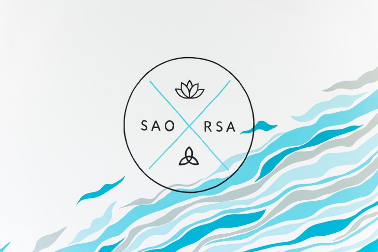 A black circular logo that reads "SAORSA" on a white background with blue waves
