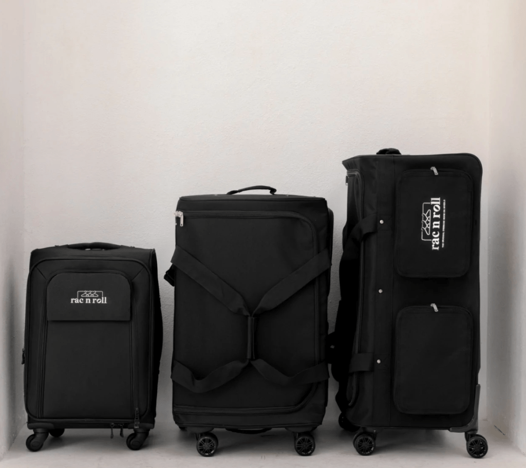 Three black suitcases of different sizes