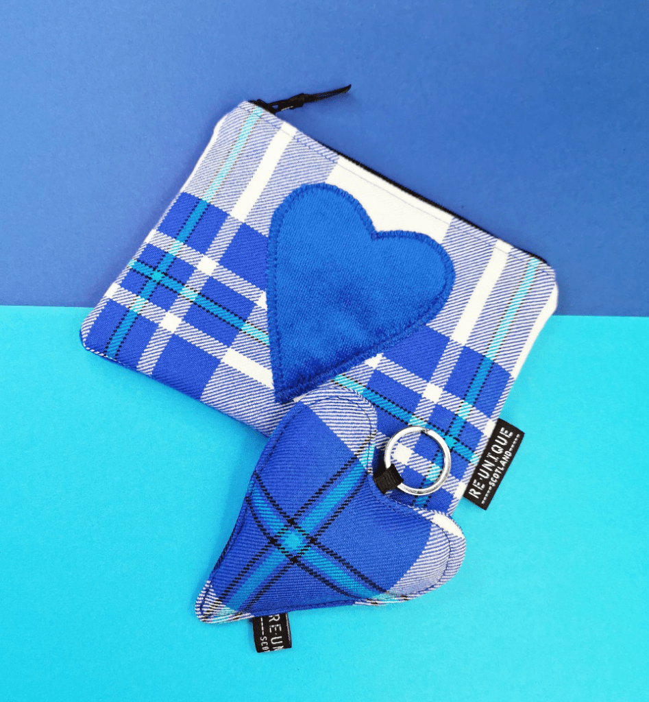 A small blue plaid bag with a heart on it