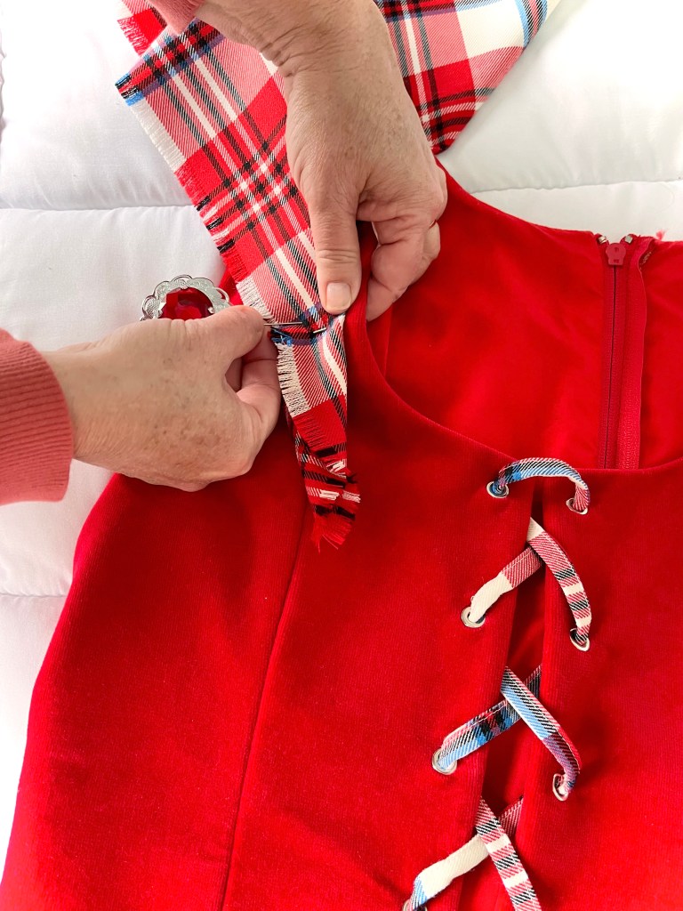 A red plaid and velvet outfit