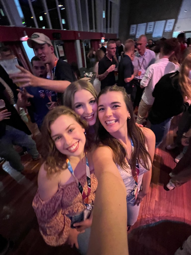3 women smile in a selfie