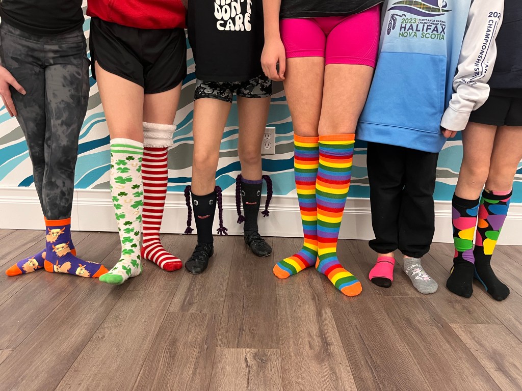 6 legs wearing fun and multicolour socks