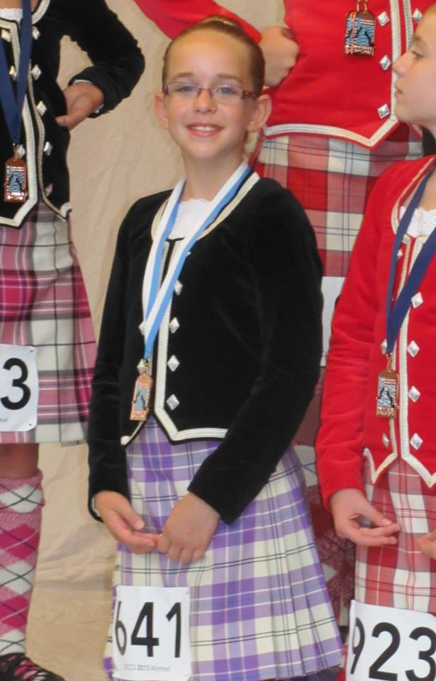 A dancer in a purple kilt