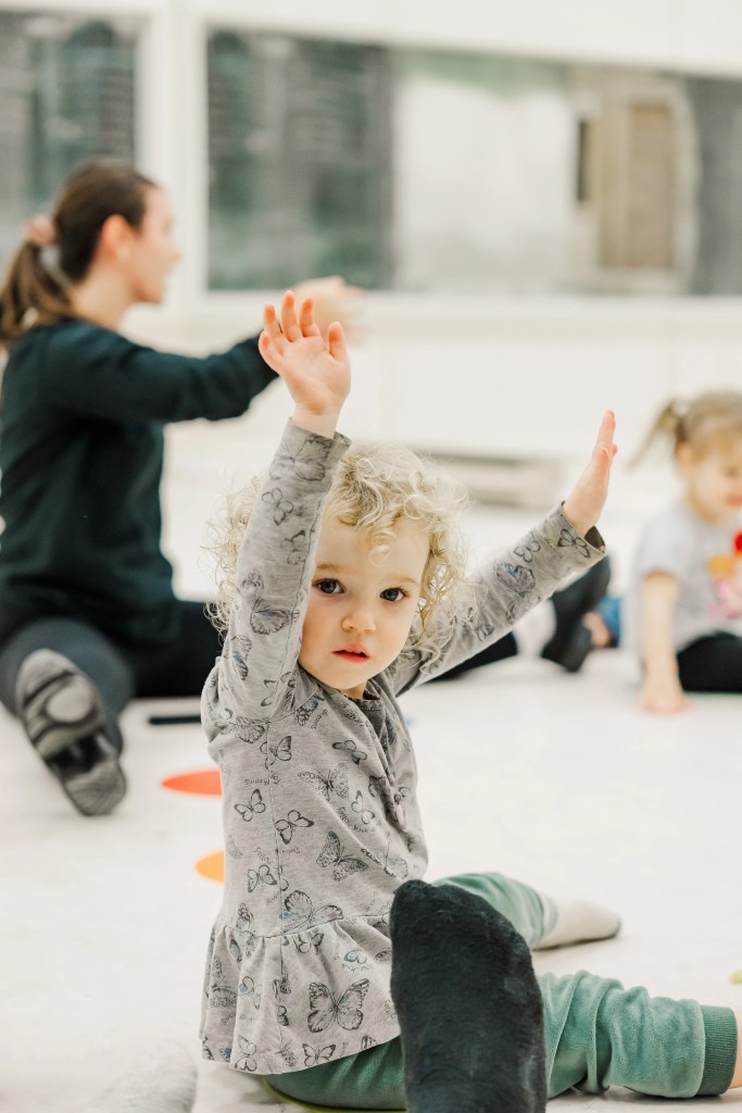 A child reaching their hands above their head. Saorsa Studio offers Highland Dance classes for ages 1 to adult in Fredericton, New Brunswick.